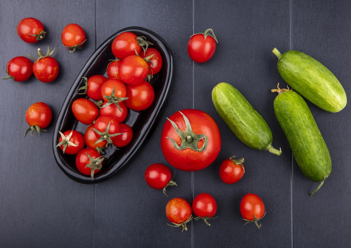 https://www.freepik.com/free-photo/top-view-tomatoes-plate-with-cucumbers-black-surface_9528480.htm